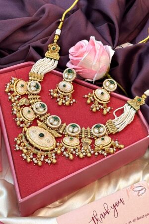 Sanskriti Emerald Magnificent Kundan Pearl Gold Polish Necklace Set