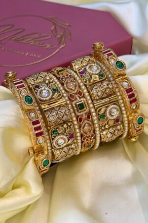 Suvarnika Virasat Ruby Emerald Gemstone Gold Polish Bangle Set For 2 Hands